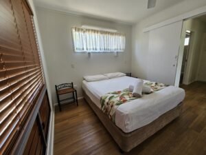 Queen bed in the main bedroom